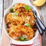 Baked cod fish in breadcrumbs in gratin dish